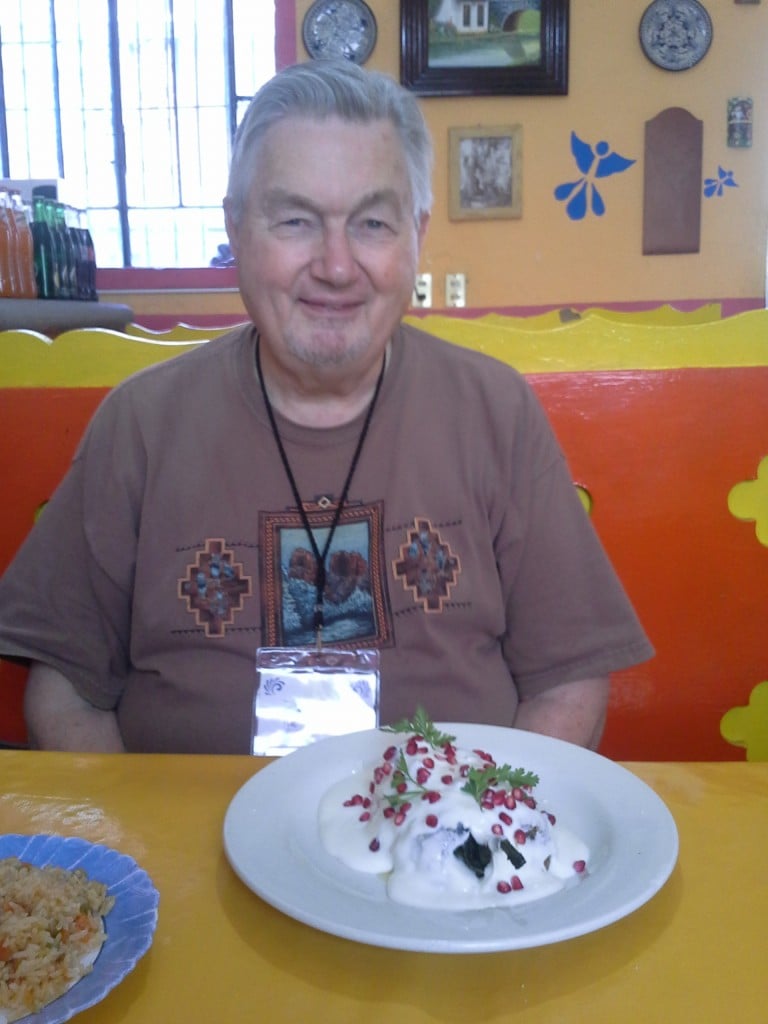 Elisha prepares to plow into his first bit of Chiles en Nogada